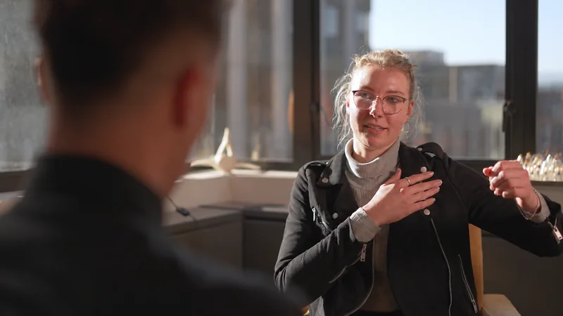 A client speaking with a practitioner during a consultation.