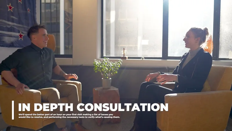 A patient and practitioner talking during a consultation at Severn Clinics.