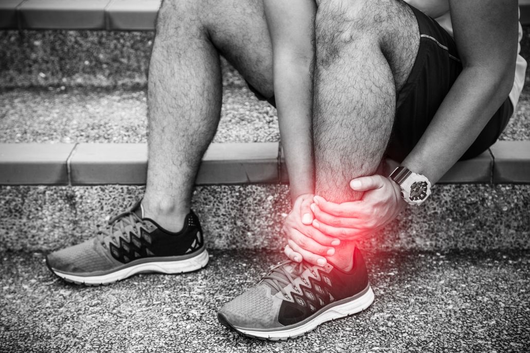 Image showing a man with a sprained ankle in the middle of a run.