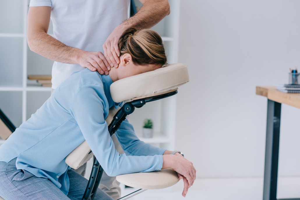 Sports therapy, Patient and practitioner delivering deep tissue release fro headaches and migraine.