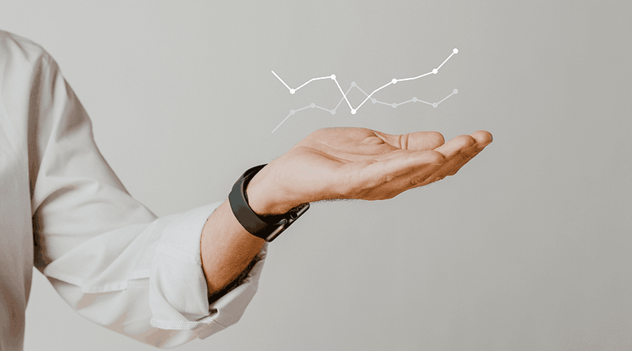 An open hand beneath an illustrated line graph.